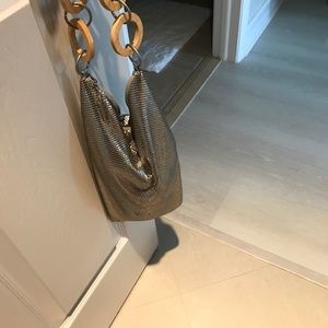 Liquid silver mesh. Unique and classy from daytime to night.